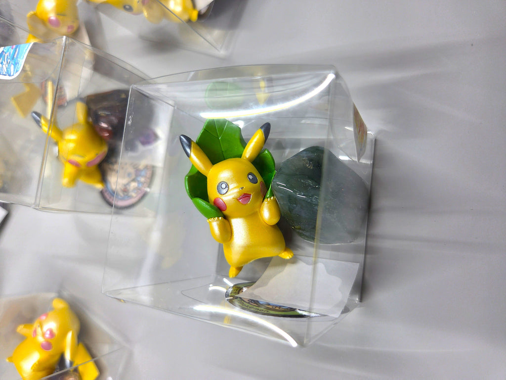 Collection of small figurines in clear packaging