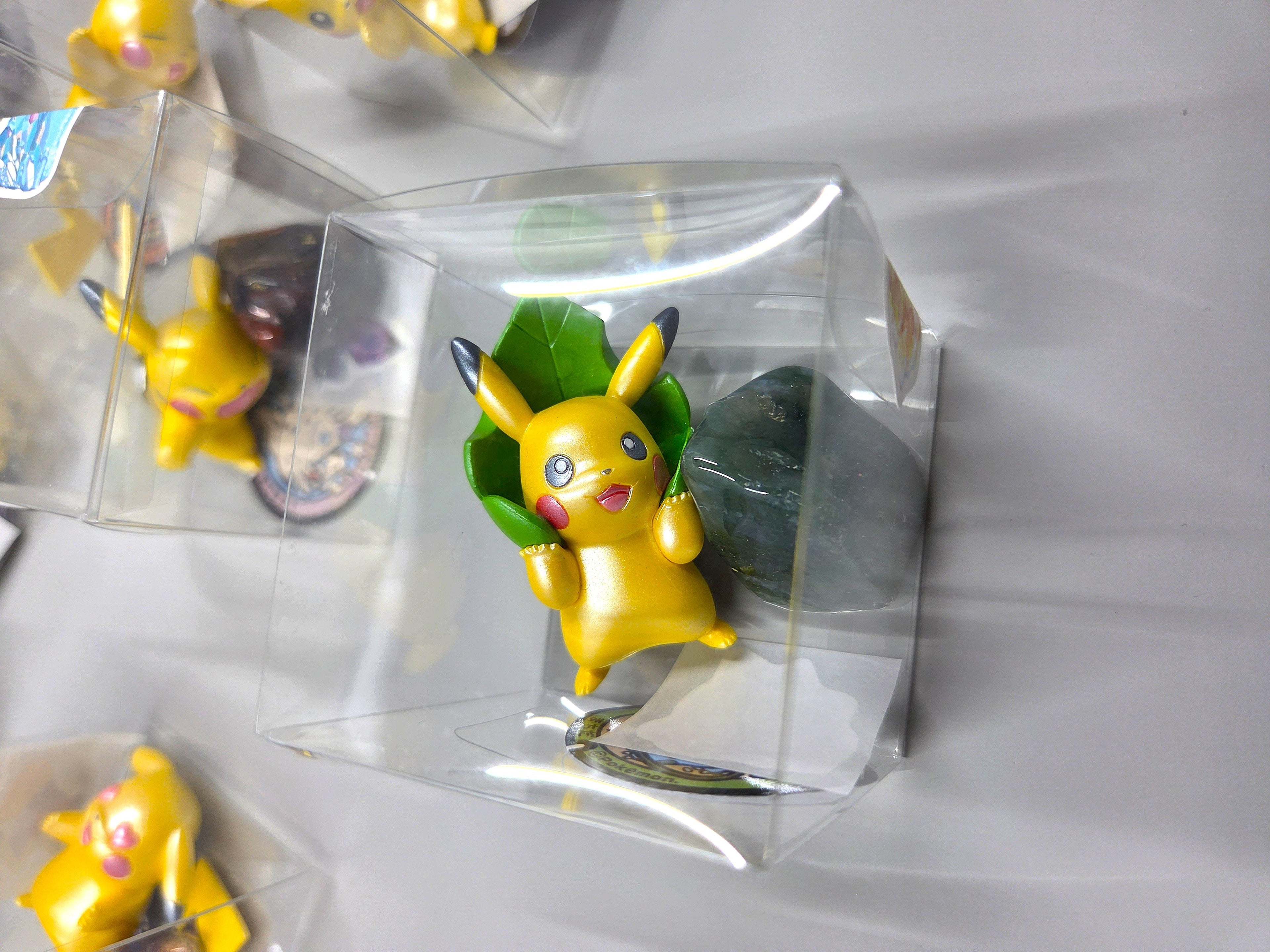 Collection of small figurines in clear packaging