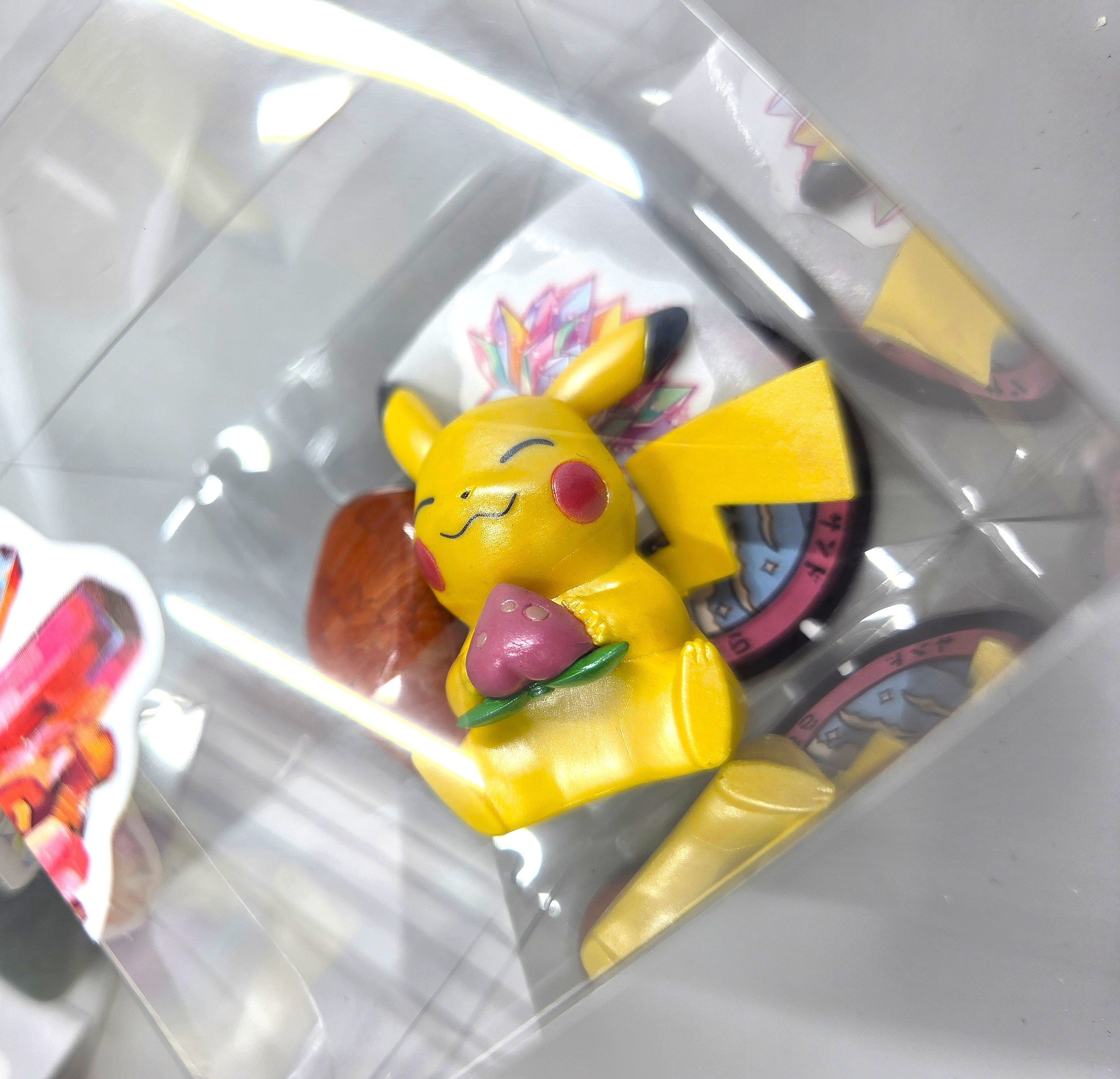 Collection of small figurines in clear packaging