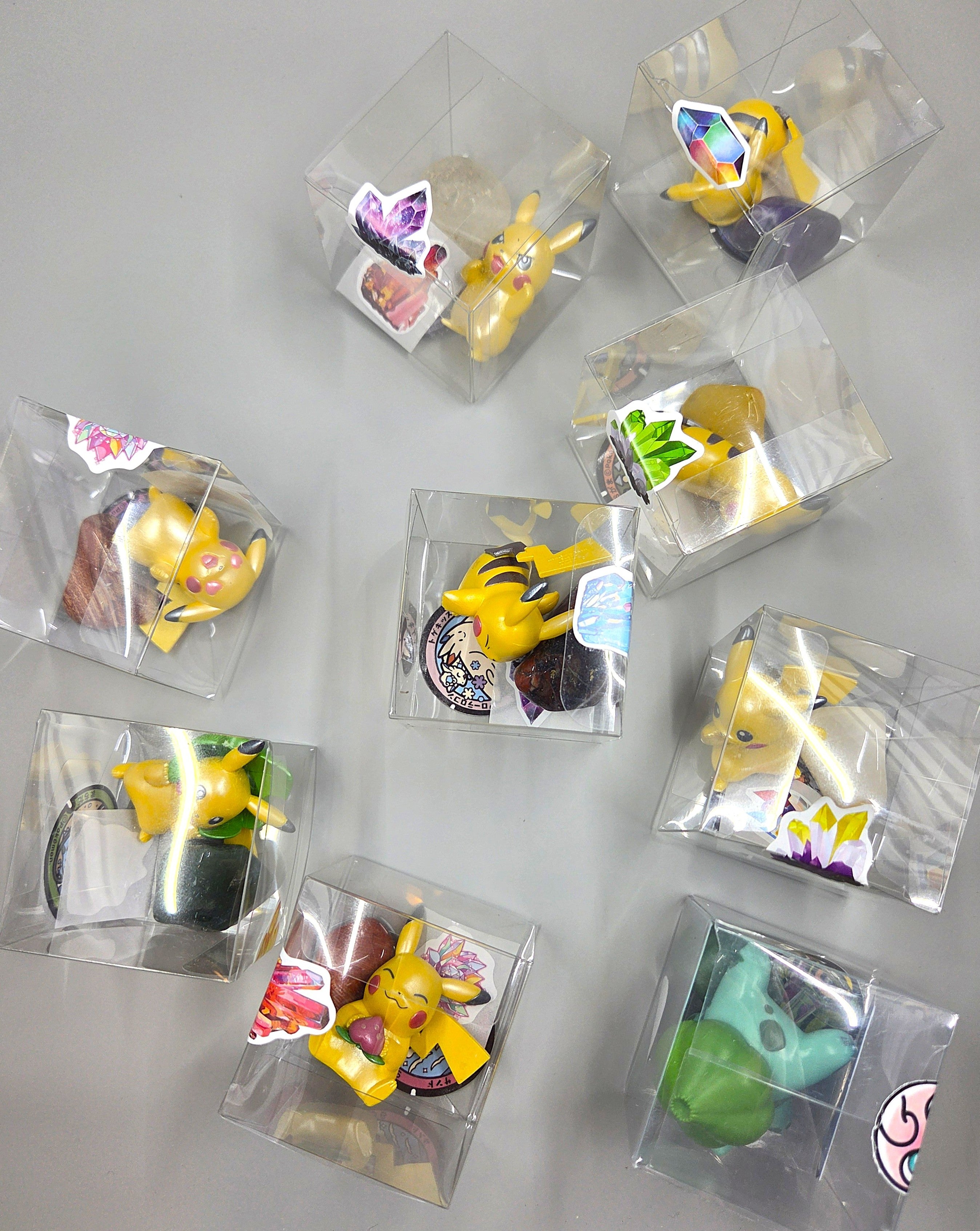 Collection of small figurines in clear packaging